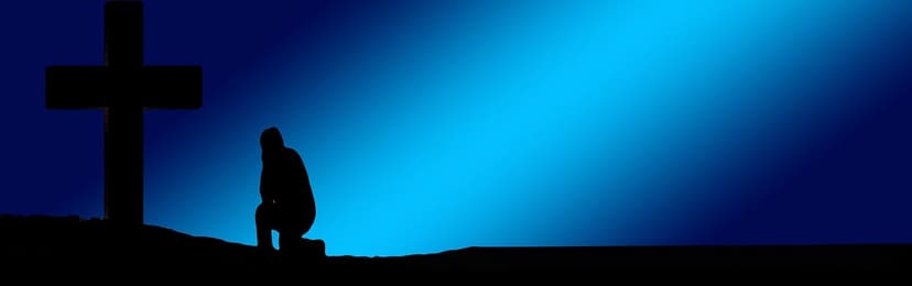 blue shading of a person kneeling before a shadowy cross