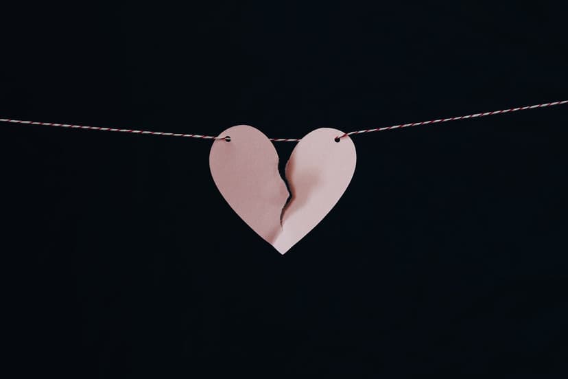 string with a pink torn paper heart hanging from it