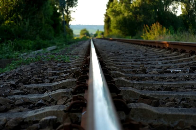 railroad rail in the midst of blurred background of nature